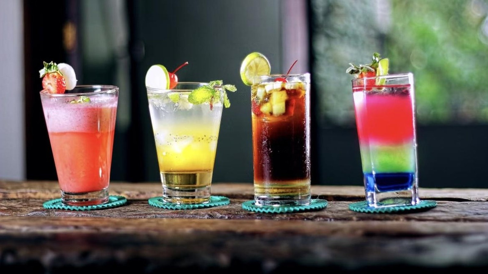 Illustrative stock photo of four colorful cocktails.