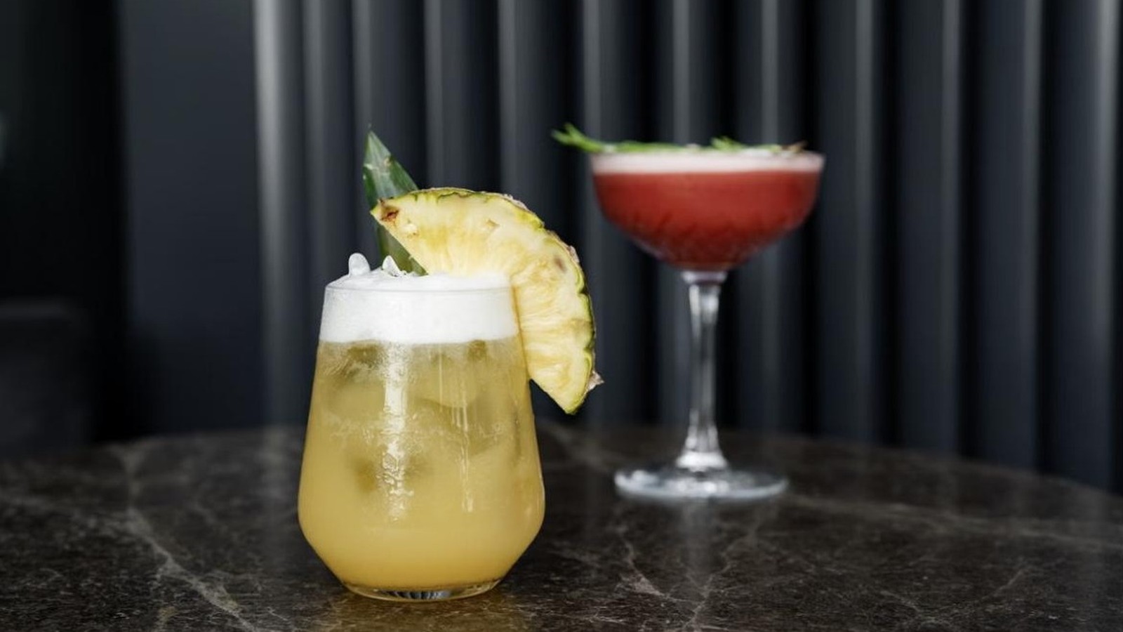 Illustrative stock photo of a pineapple-garnished cocktail.