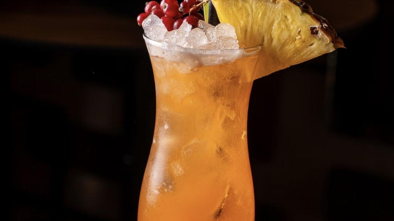 Illustrative stock photo of a tropical cocktail with a pineapple garnish.
